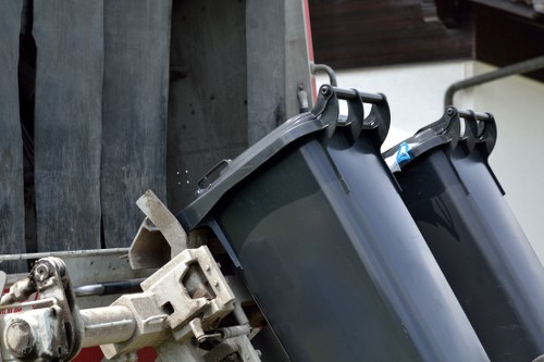 A contractor placing a skip on a public road in Surbiton.